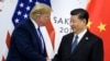 资料照片：特朗普总统与习近平主席在大阪20国集团峰会期间握手（2019年6月29日）