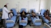 FILE - A doctor attends to cancer patients at a cancer treatment center in Sana'a, Yemen, Feb. 11, 2017. 