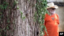 FILE - Guitarist Dickey Betts, founding member of the Allman Brothers Band, attends Gregg Allman's burial at Rose Hill Cemetery, Saturday, June 3, 2017, in Macon, Ga. Betts, 80, has died, his manager said. 