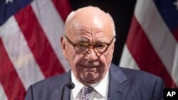FILE - Rupert Murdoch introduces Secretary of State Mike Pompeo during the Herman Kahn Award Gala, Oct. 30, 2019, in New York. 