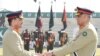 Pakistan's outgoing army chief General Qamar Javed Bajwa, right, handed over the symbolic baton to his successor, General Asim Munir, at a ceremony at the general headquarters in Rawalpindi, Nov. 29, 2022. (Photo courtesy of Inter Services Public Relations)