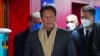 Pakistan's Prime Minister Imran Khan arrives for the opening ceremony of the 2022 Winter Olympics, Feb. 4, 2022, in Beijing. 