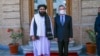 This handout photo released by the Taliban Foreign Ministry shows Taliban Foreign Minister Amir Khan Muttaqi, left, posing with China's Foreign Minister Wang Yi in Kabul on March 24, 2022.