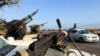 FILE - Military vehicles mounted with heavy weapons belonging to pro-PM Dbeibah Constitution Protection Force are pictured in Tripoli, Libya, May 17, 2022. 