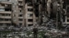 A Ukrainian serviceman walks amid the rubble of a building heavily damaged by multiple Russian bombardments near a frontline in Kharkiv, Ukraine, April 25, 2022.