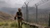 FILE - In this Aug. 3, 2021, file photo, Pakistan Army troops patrol along the border of Pakistan and Afghanistan. Pakistan said on Dec. 29, 2022, that at least three of its soldiers were killed in clashes with “terrorists” near the border.