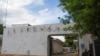 Police sit outside the facilities of La Prensa newspaper in Managua, Nicaragua Aug. 23, 2022.
