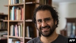 FILE - This photo taken on May 17, 2019, shows Egyptian activist and blogger Alaa Abdel Fattah at his Cairo home. His family said on Nov. 6, 2022, that he has stopped drinking water, escalating his hunger strike as world leaders arrive in Egypt for the COP27 climate summit. 