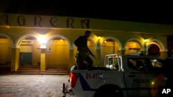 FILE - Police patrol in Liberty Square in central San Salvador, El Salvador, Aug. 20, 2018.