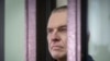 Journalist Andrzej Poczobut stands in a defendants' cage during a court session in Grodno, Belarus, Jan. 16, 2023. 