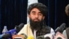 FILE - Taliban spokesperson Zabihullah Mujahid looks on as he addresses the first press conference in Kabul on Aug. 17, 2021.