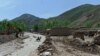 FILE - An Afghan man on a horse crosses a river in Sar-e Pol province, May 8, 2012. Taliban authorities are being accused of human rights abuses as they attempt to quell a rebellion in northern Sar-e Pol province in June 2022.