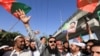 Supporters of the Pakistan Tehreek-e-Insaf, political party, chant slogans accusing the U.S. of plotting to overthrow Pakistani Prime Minister Imran Khan, during a protest in Peshawar, April 4, 2022.