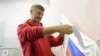 FILE - Opposition mayoral candidate Yevgeny Roizman casts his ballot at a polling station during a mayoral election in the Urals city of Yekaterinburg, Sept. 8, 2013.