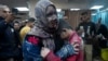 Palestinians wounded in the Israeli bombardment of the Gaza Strip are brought to the hospital in Deir al Balah on Dec. 8, 2023.