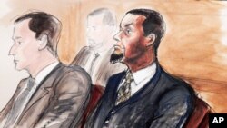 FILE - Tairod Nathan Webster Pugh (r) sits at the defense table with his attorney Zachary S. Taylor, during jury selection in a federal court in the Brooklyn borough of New York, Feb. 24, 2016.