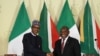 Nigeria's President Muhammadu Buhari shakes hands with his South African counterpart Cyril Ramaphosa during a news conference after a meeting, in Pretoria, South Africa, Oct. 3, 2019.
