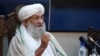 Taliban Prime Minister Mohammad Hassan Akhund speaks during an economic conference at the former Presidential Palace in Kabul, Afghanistan, Jan. 19, 2022.