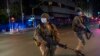 South African Defense Forces patrol downtown Johannesburg, South Africa, Friday, March 27, 2020. Police and army started patrolling moments after South Africa went into a nationwide lockdown for 21 days in an effort to mitigate the spread to the…