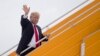 U.S. President Donald Trump waves as he leaves Danang for Hanoi, Vietnam, after attending the Asia-Pacific Economic Cooperation (APEC) Summit, Nov. 11, 2017.