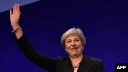 PM Inggris Theresa May di Birmingham, Inggris, 3 Oktober 2018.