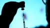 FILE - A dose of Pfizer COVID-19 vaccine is prepared on Nov. 5, 2021, in Chicago. 