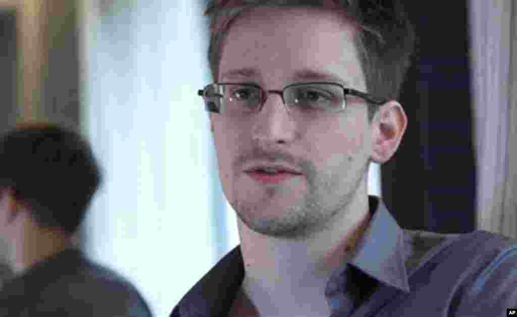 This photo provided by The Guardian Newspaper in London shows form NSA contractor Edward Snowden in Hong Kong after he leaked classified documents, June 9, 2013.