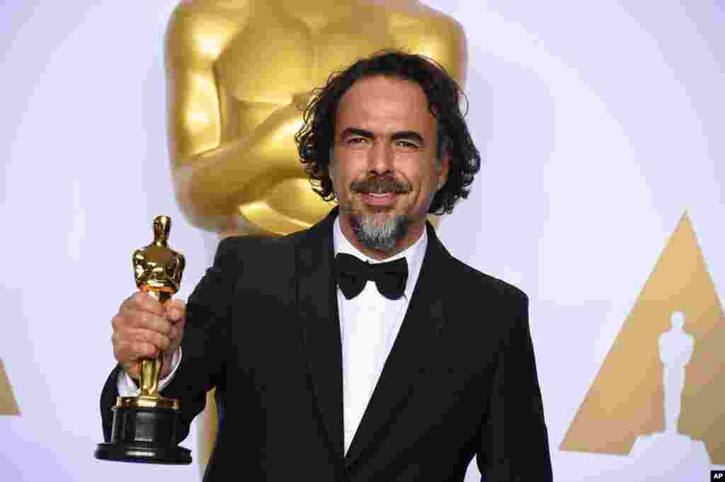 Alejandro G. Inarritu poses in the press room with the award for best director for “The Revenant” at the Oscars on Feb. 28, 2016, at the Dolby Theatre in Los Angeles. 