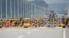 FILE - A soldier stands guard at a checkpoint on the Grand Unification Bridge which leads to the inter-Korean Kaesong Industrial Complex in North Korea, just south of the demilitarized zone separating the two Koreas, in Paju, South Korea, June 17, 2020. 
