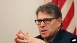 FILE - The outgoing U.S. Energy Secretary Rick Perry talks to the journalists during a roundtable presser in Dubai, United Arab Emirates, Oct. 26, 2019.