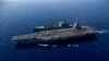 Крупнейший в мире авианосец USS Gerald R. Ford идет рядом с USNS Laramie во время заправки в восточной части Средиземного моря. 11 октября 2023 года.