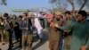 Relatives carry the body of Mushtaq Ahmed, 41, who was killed when an enraged mob stoned him to death for allegedly desecrating the Quran, in Tulamba, a remote village in the district of Khanewal in eastern Pakistan, Feb. 13, 2022.