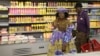 FILE - A Herero woman shops at a Shoprite store in Otjinene Village in the Omaheke Region, Namibia, Feb. 22, 2017. 