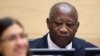 Former Ivory Coast President Laurent Gbagbo waits for the judge to arrive as he appears for the first time at the International Criminal Court to face charges of crimes against humanity in The Hague, Netherlands, Dec. 5, 2011. Gbagbo was extradited to the