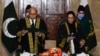 This handout photograph taken on Jan. 24, 2022, released by the Pakistan’s Press Information Department, shows chief justice Gulzar Ahmed
administering the oath to justice Ayesha Malik, in Islamabad. (Photo by Pakistan Press Information Department/AFP)
