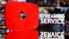 Un logotipo de Youtube impreso en 3D se puede ver frente a las palabras "Servicio de transmisión" en esta ilustración.