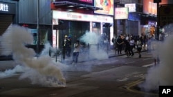 Tear gas engulf the streets of Hong Kong, Oct. 27, 2019. 